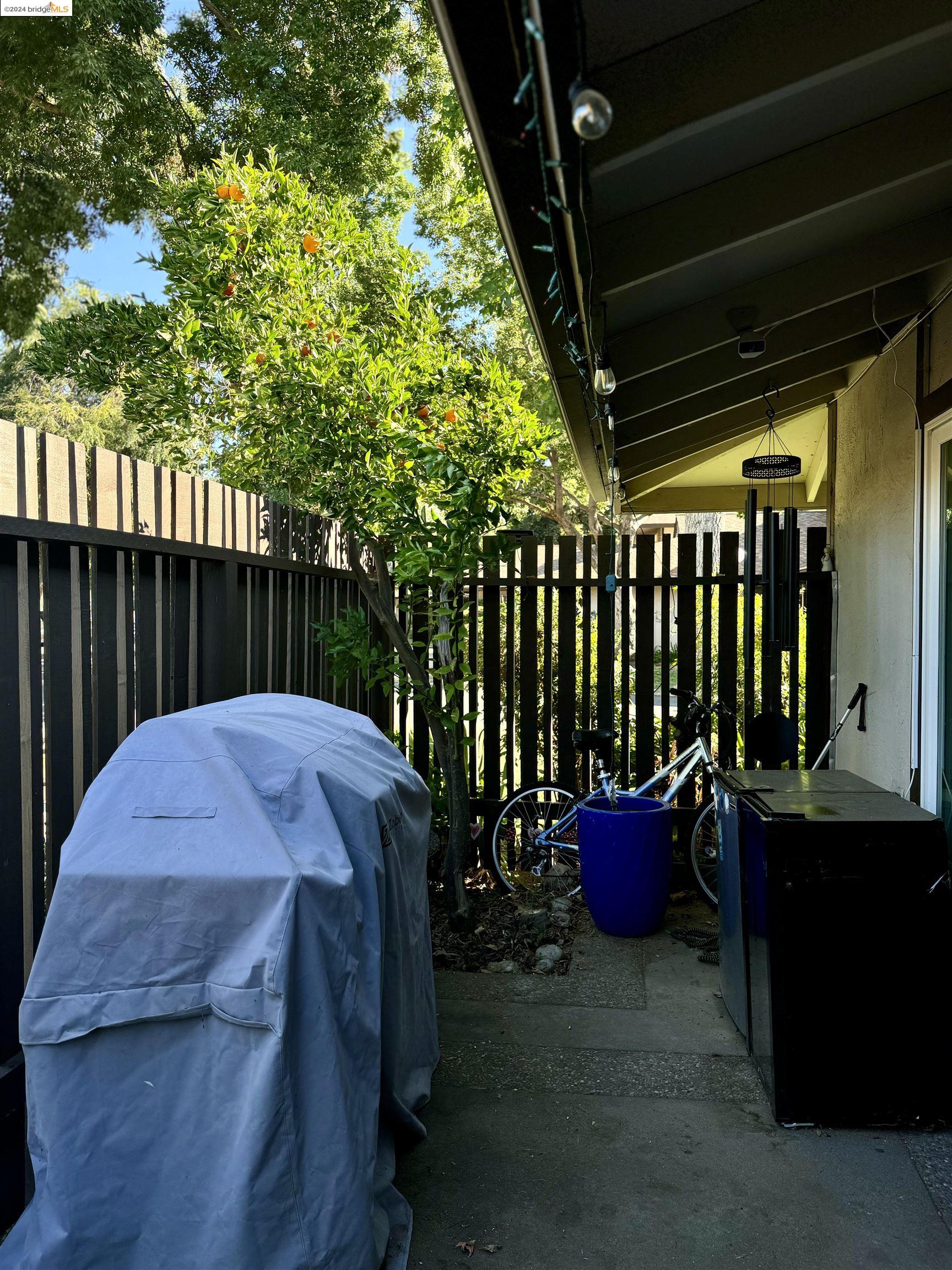5519 Roundtree Drive, Unit A Concord, CA 94521 - Photo 3 of 9 a dinning table and chairs in patio