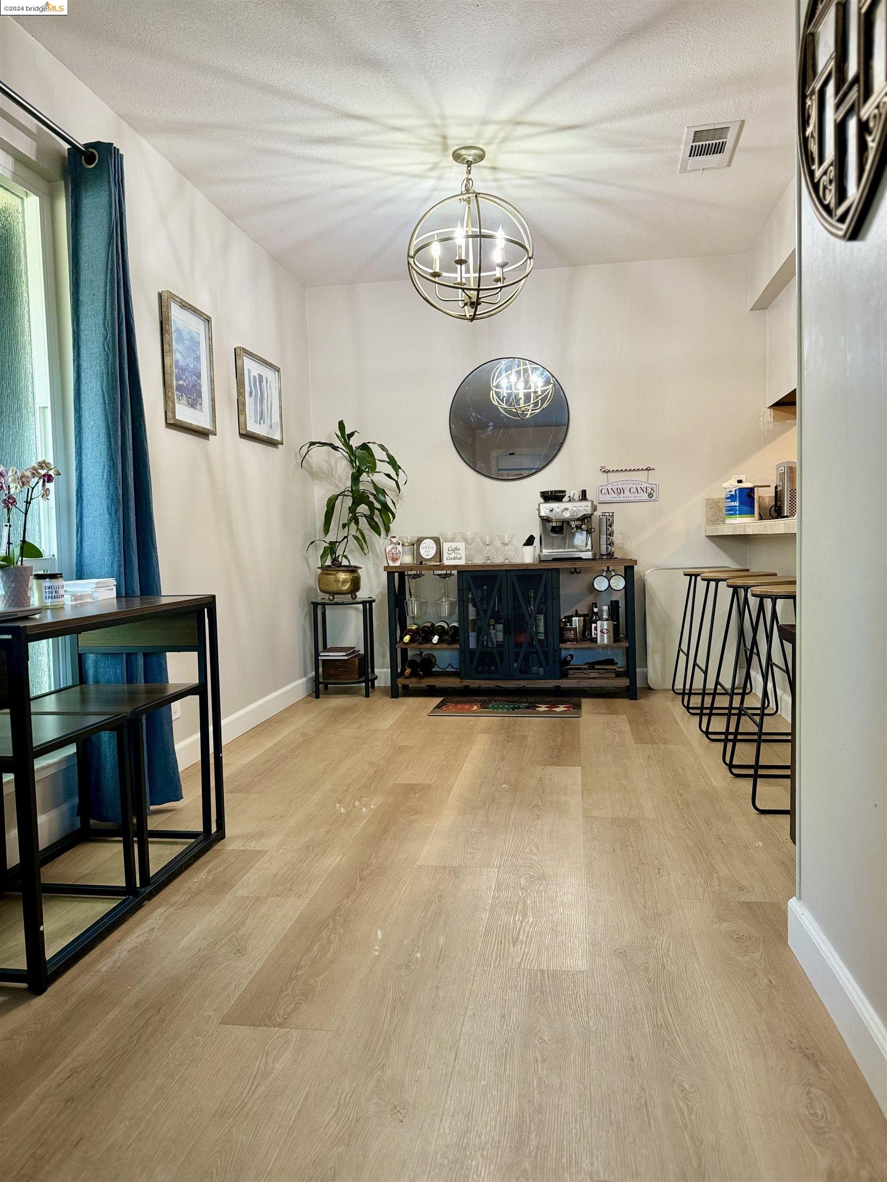 5519 Roundtree Drive, Unit A Concord, CA 94521 - Photo 5 of 9 a view of a room with furniture and chandelier