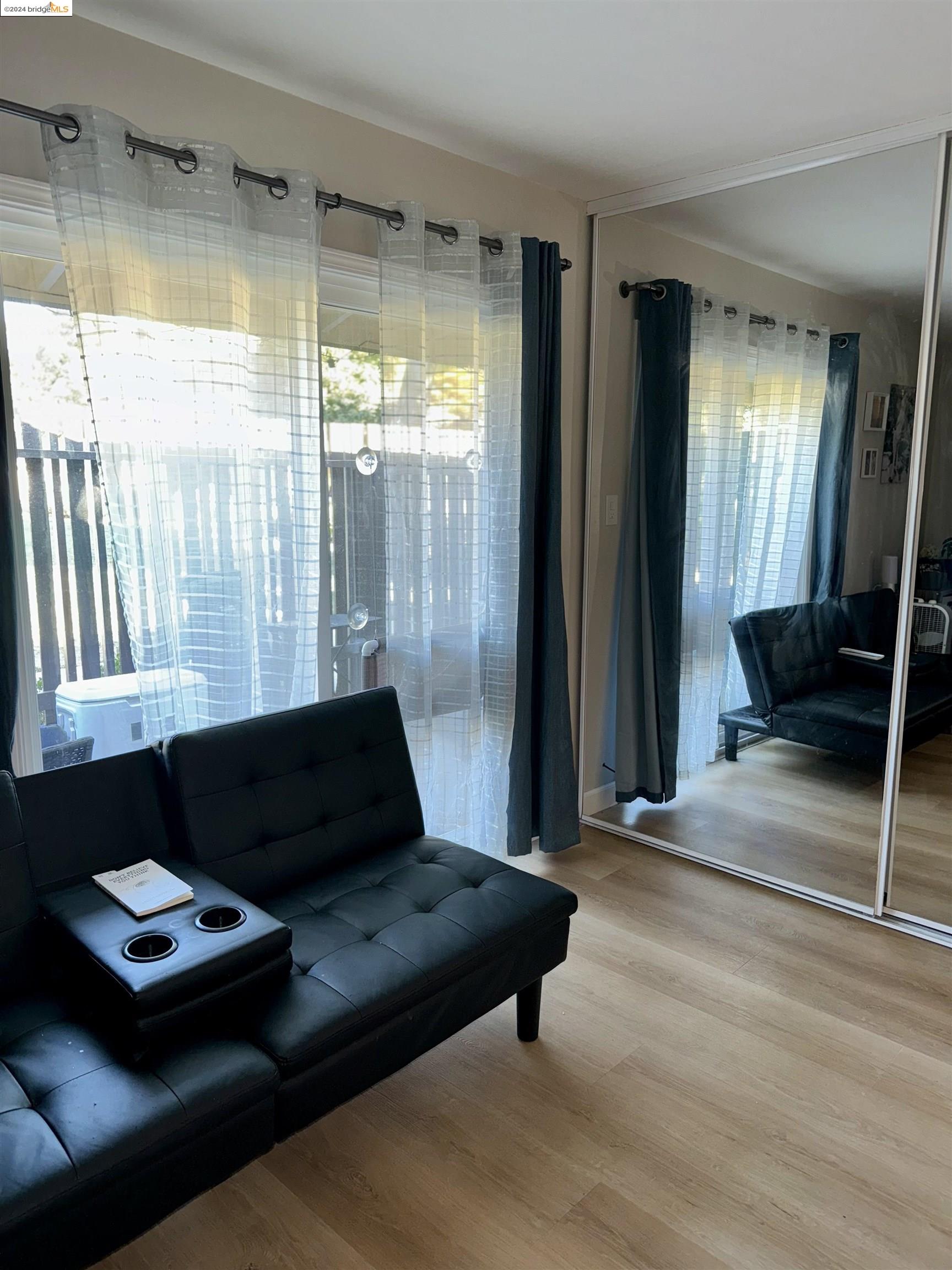 5519 Roundtree Drive, Unit A Concord, CA 94521 - Photo 6 of 9 a living room with furniture and a window