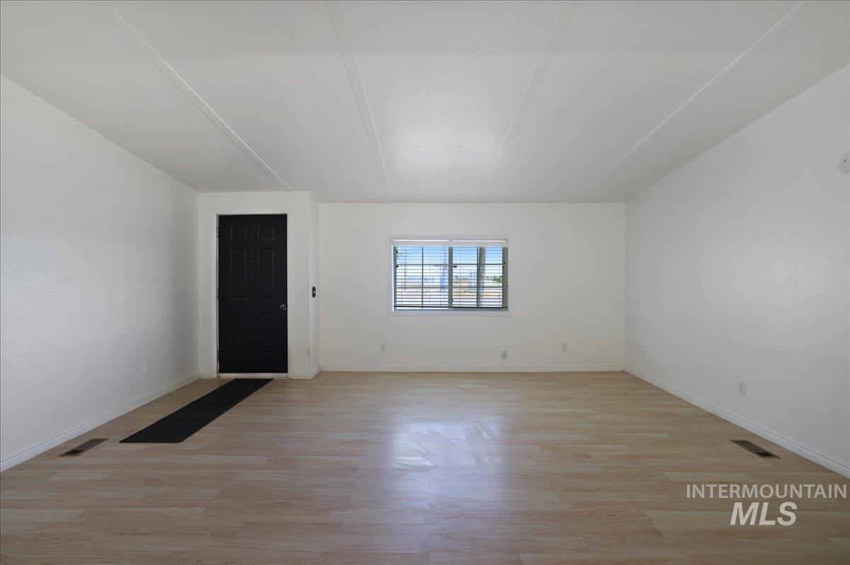 943 North 200 West Rupert, ID 83350 - Photo 5 of 35 Additional living space with light wood-style flooring and baseboards