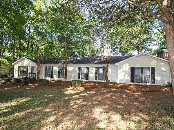 165 McAlway Road Charlotte, NC 28211 - Photo 1 of 23 a front view of a house with a garden
