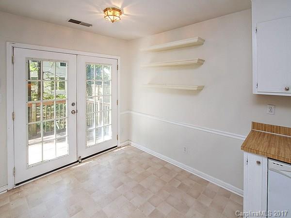 165 McAlway Road Charlotte, NC 28211 - Photo 12 of 23 an empty room with windows and cabinet