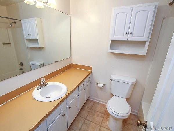 165 McAlway Road Charlotte, NC 28211 - Photo 15 of 23 a bathroom with a granite countertop toilet sink and mirror