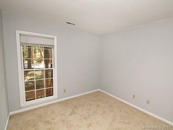 165 McAlway Road Charlotte, NC 28211 - Photo 19 of 23 a view of an empty room with a window