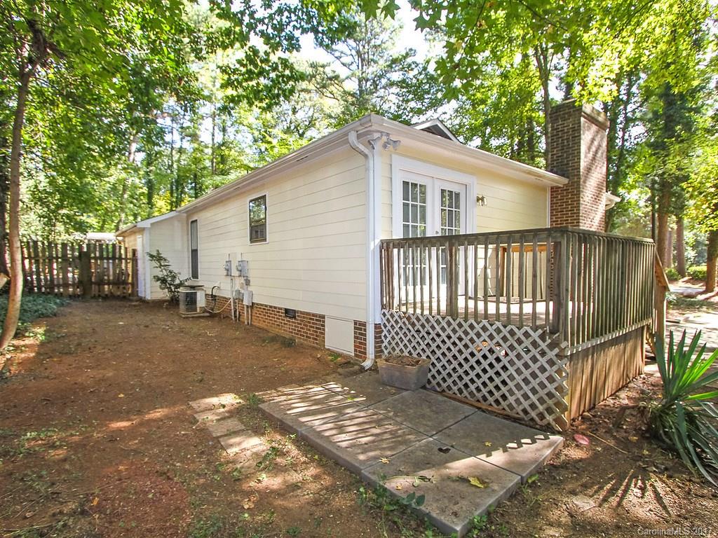 165 McAlway Road Charlotte, NC 28211 - Photo 23 of 23 a view of a white house with a small yard and wooden fence