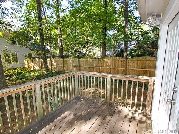 165 McAlway Road Charlotte, NC 28211 - Photo 7 of 23 a view of balcony with wooden floor and fence