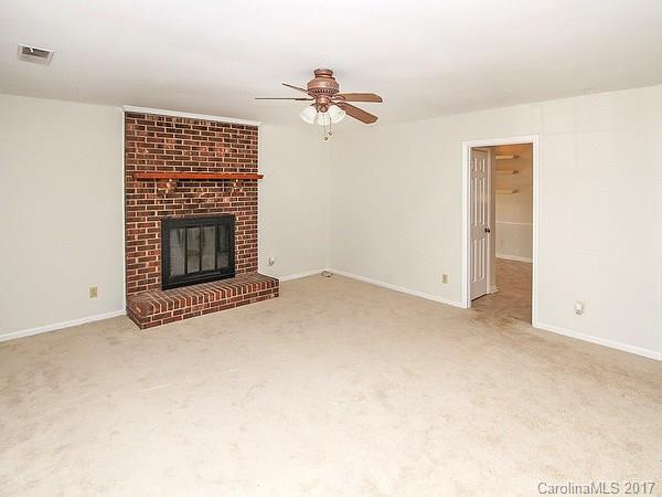 165 McAlway Road Charlotte, NC 28211 - Photo 8 of 23 a view of empty room with a fireplace