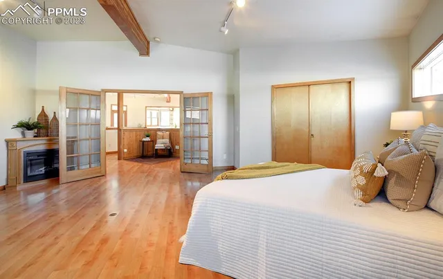 a bathroom with a tub a sink and mirror