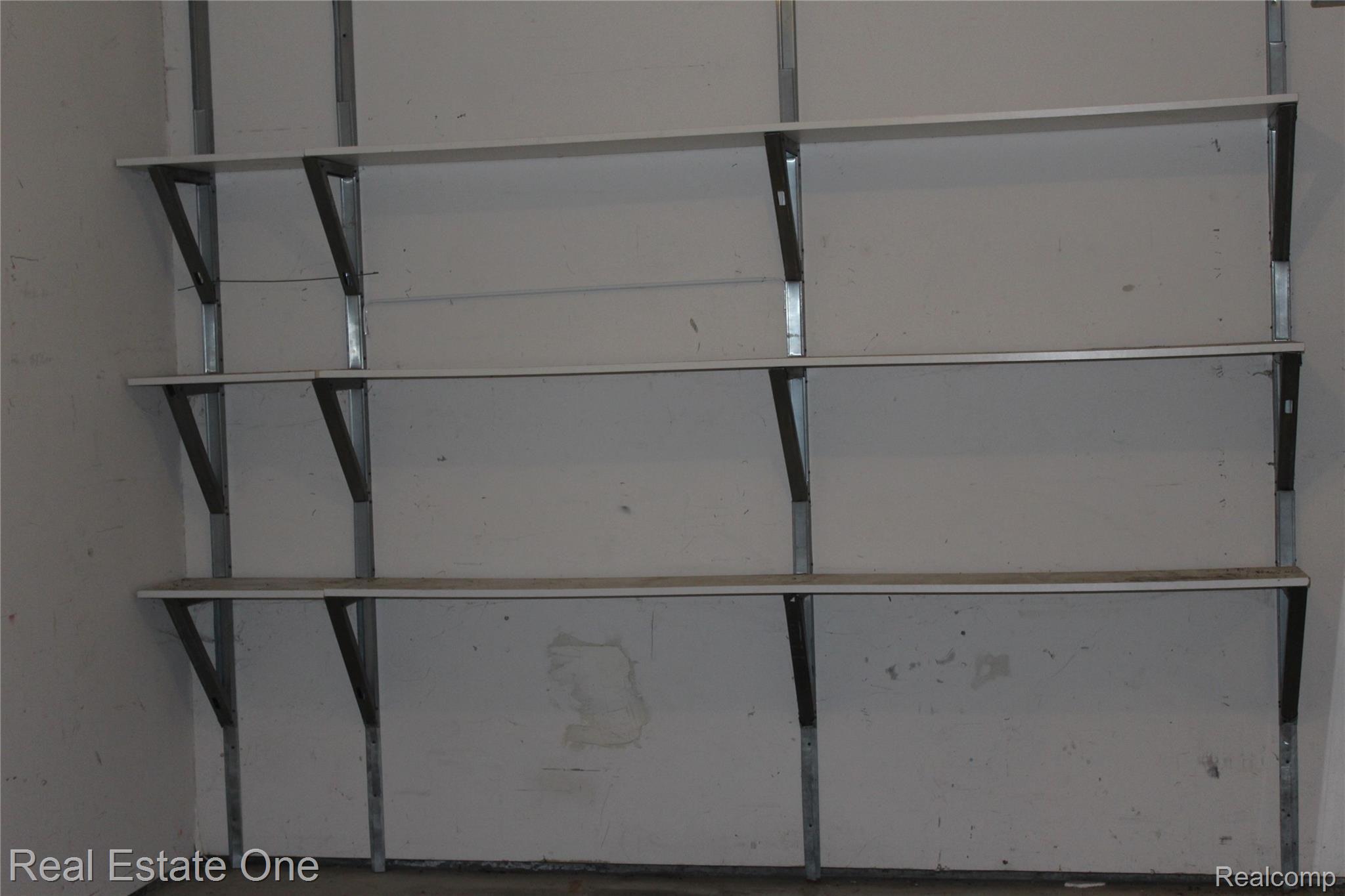 10026 West Mount Morris Road Flushing, MI 48433 - Photo 29 of 30 Garage storage shelves