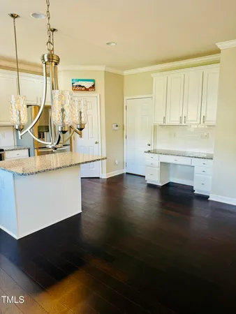 a view of a living room with hardwood floor