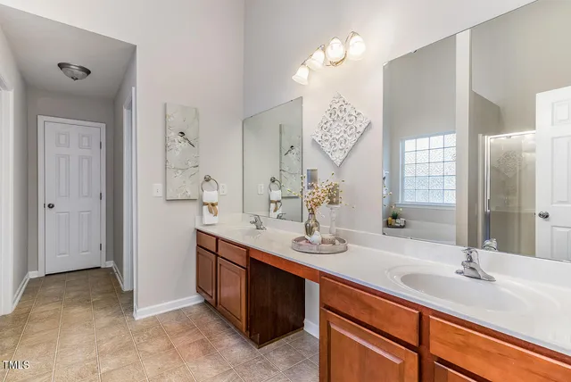 a bathroom with a sink toilet and mirror