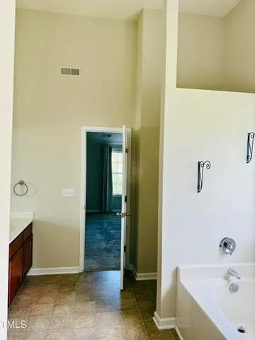a bathroom with a sink double vanity and a mirror