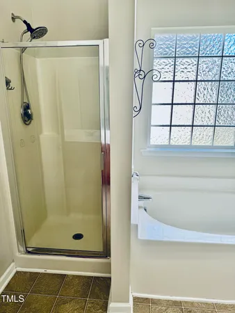 a bathroom with a tub and sink