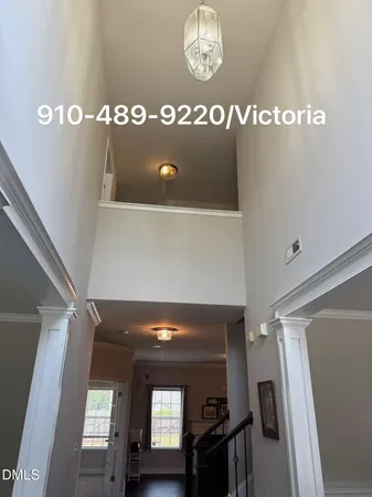 an aerial view of a house with garden space and street view