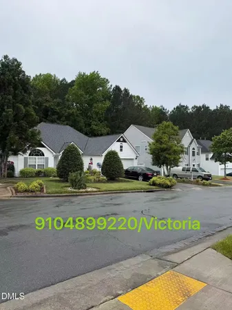 a view of a street with a building in the background