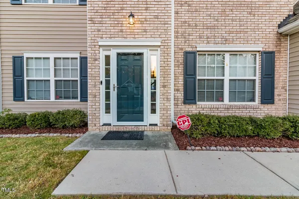 a front view of a house with outdoor space
