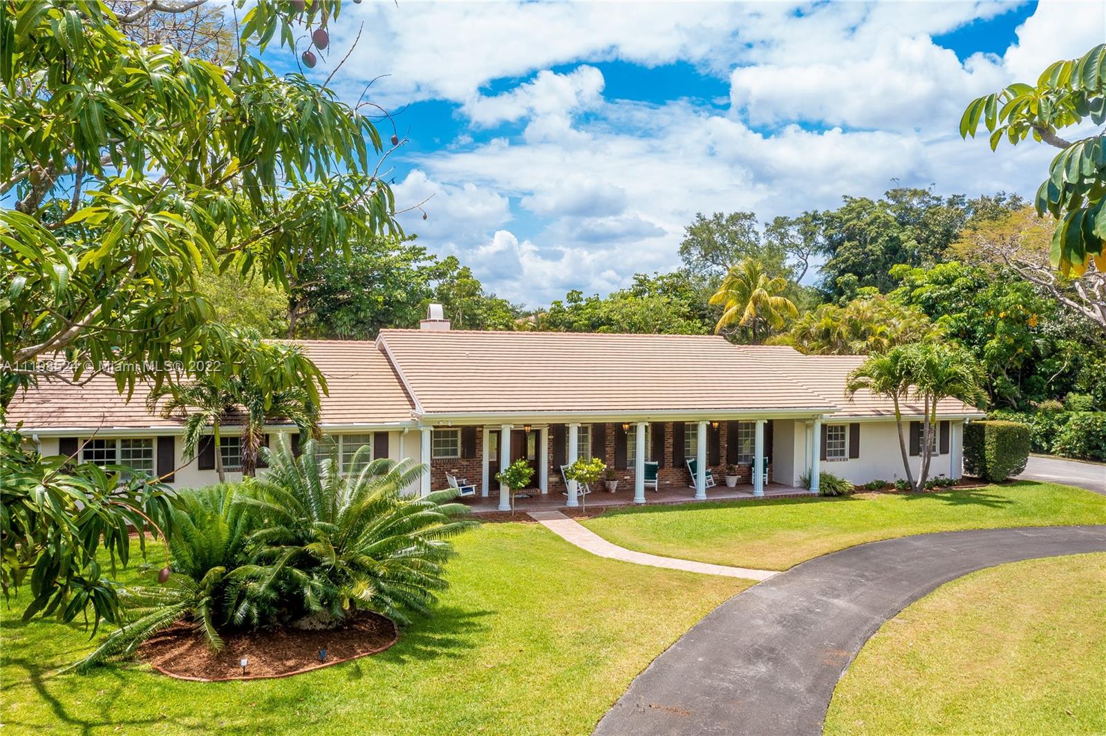 12440 Old Cutler Road Pinecrest, FL 33156 - Photo 3 of 54 a view of a house with a swimming pool