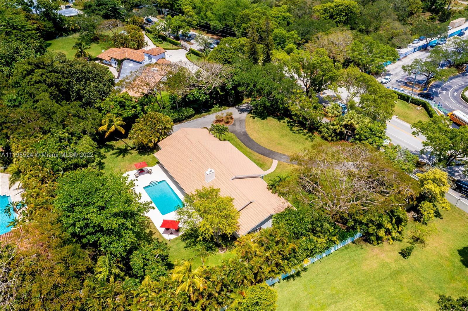 12440 Old Cutler Road Pinecrest, FL 33156 - Photo 5 of 54 a view of a tree with a flower garden