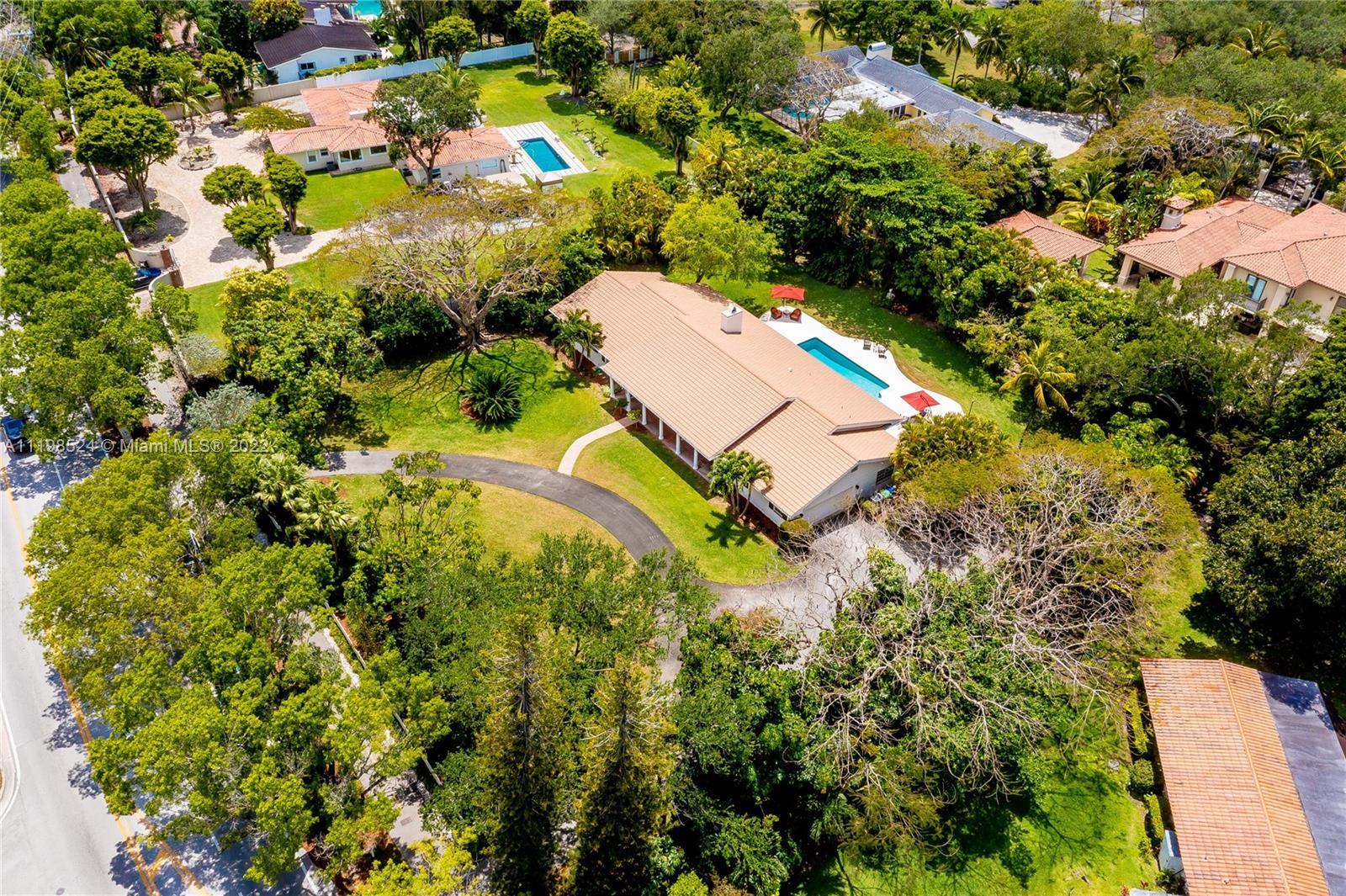 12440 Old Cutler Road Pinecrest, FL 33156 - Photo 54 of 54 an aerial view of a house with a yard