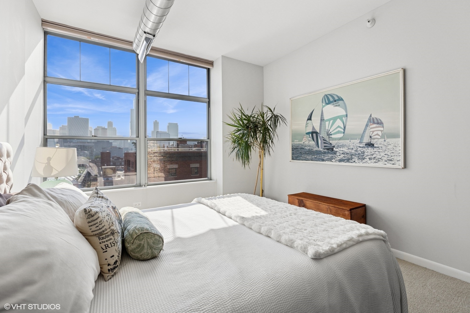 1200 West Monroe Street, Unit 805 Chicago, IL 60607 - Photo 14 of 21 a bedroom with a large bed and a window