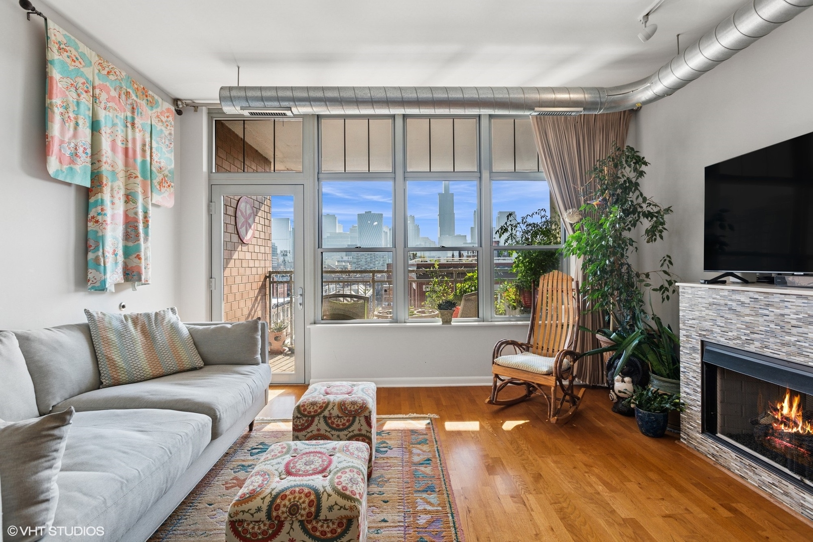 1200 West Monroe Street, Unit 805 Chicago, IL 60607 - Photo 3 of 21 a living room with furniture fireplace and flat screen tv