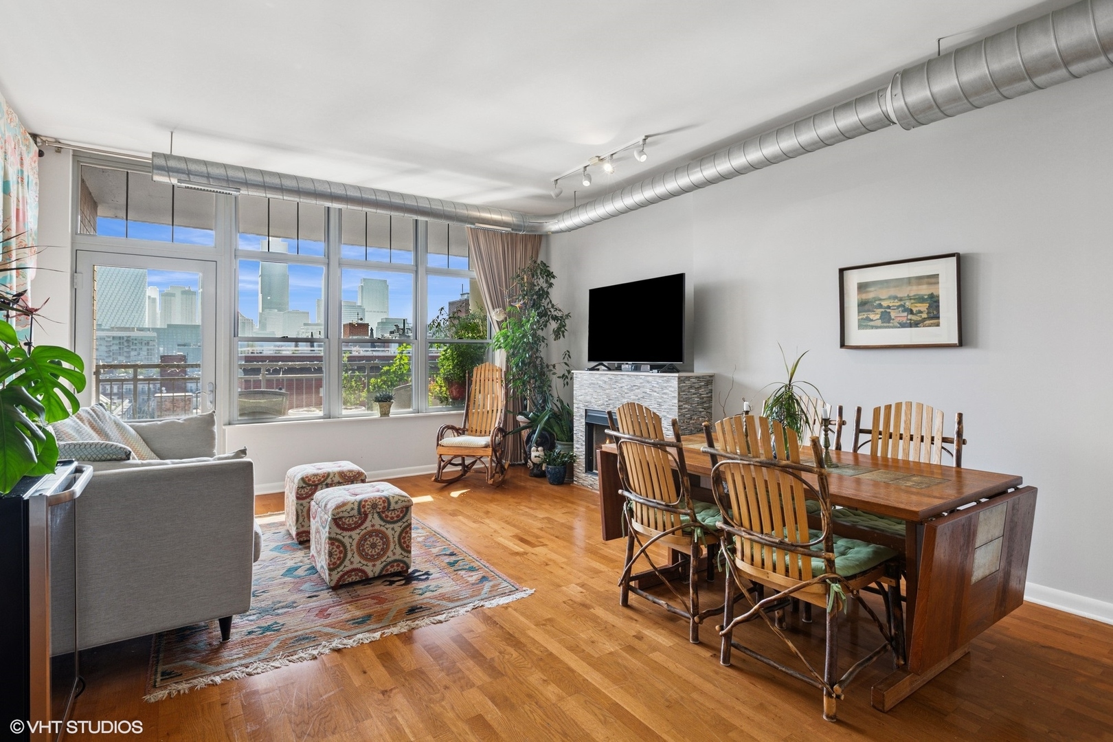 1200 West Monroe Street, Unit 805 Chicago, IL 60607 - Photo 6 of 21 a view of a livingroom with furniture and a flat screen tv