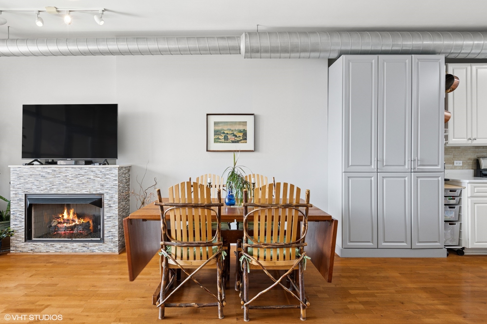 1200 West Monroe Street, Unit 805 Chicago, IL 60607 - Photo 7 of 21 a view of a livingroom with furniture and a fireplace