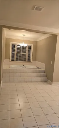 a view of empty room with white walls