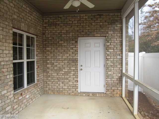 1429 Downington Road Clemmons, NC 27012 - Photo 15 of 16 Exterior Back. screened in porch and storage unit--helps provide privacy as well!