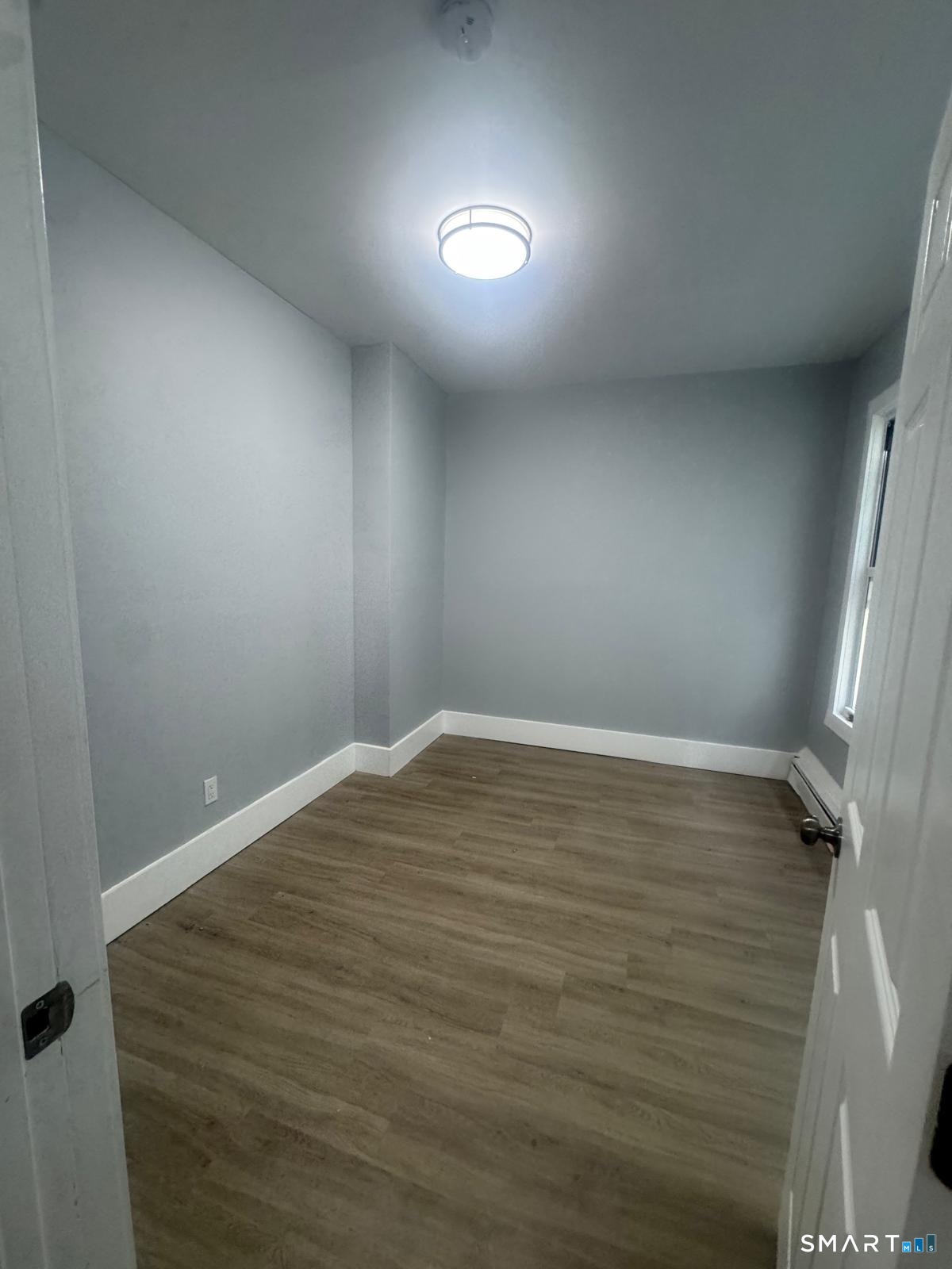 105 Caroline Street, Unit 3 Bridgeport, CT 06608 - Photo 6 of 7 a view of an empty room