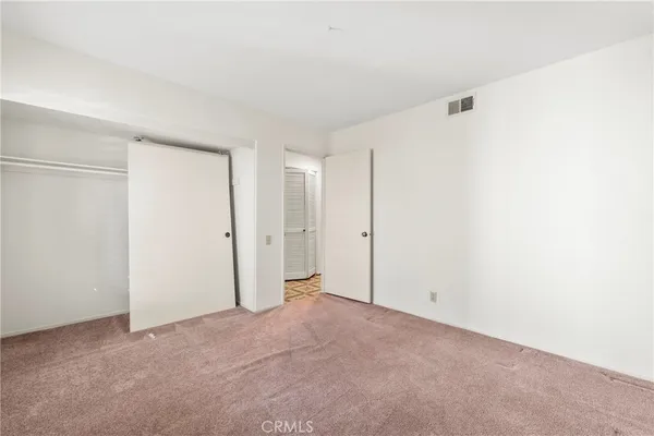 a balcony with wooden floor and fence