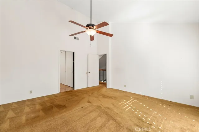 a spacious bathroom with a mirror sink and shower