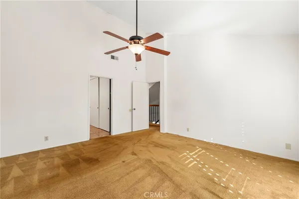 a spacious bathroom with a mirror sink and shower
