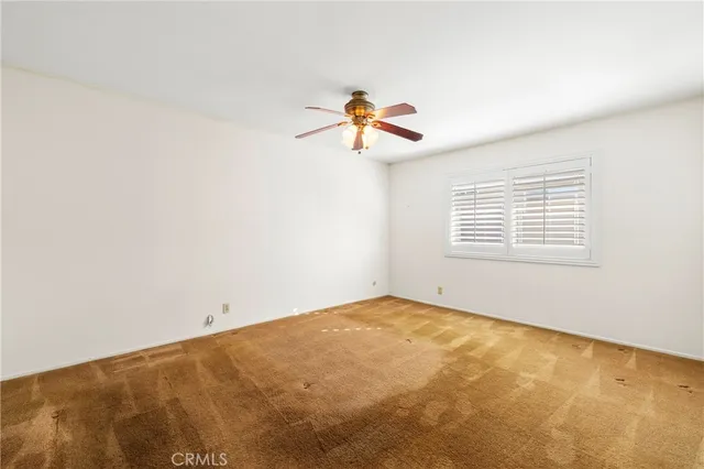a view of a house with a backyard porch and sitting area