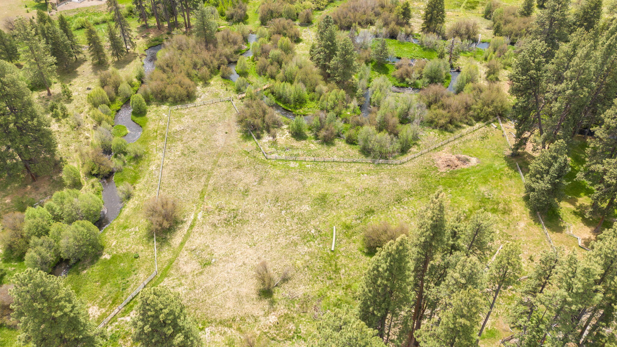 26223 Southwest Pine Lodge Road Camp Sherman, OR 97730 - Photo 45 of 60 Shows the meadow and creek basin