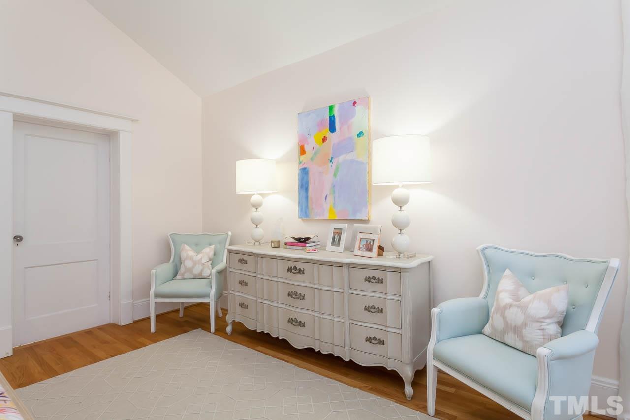 1702 Dare Street Raleigh, NC 27608 - Photo 14 of 25 a living room with furniture and a dresser