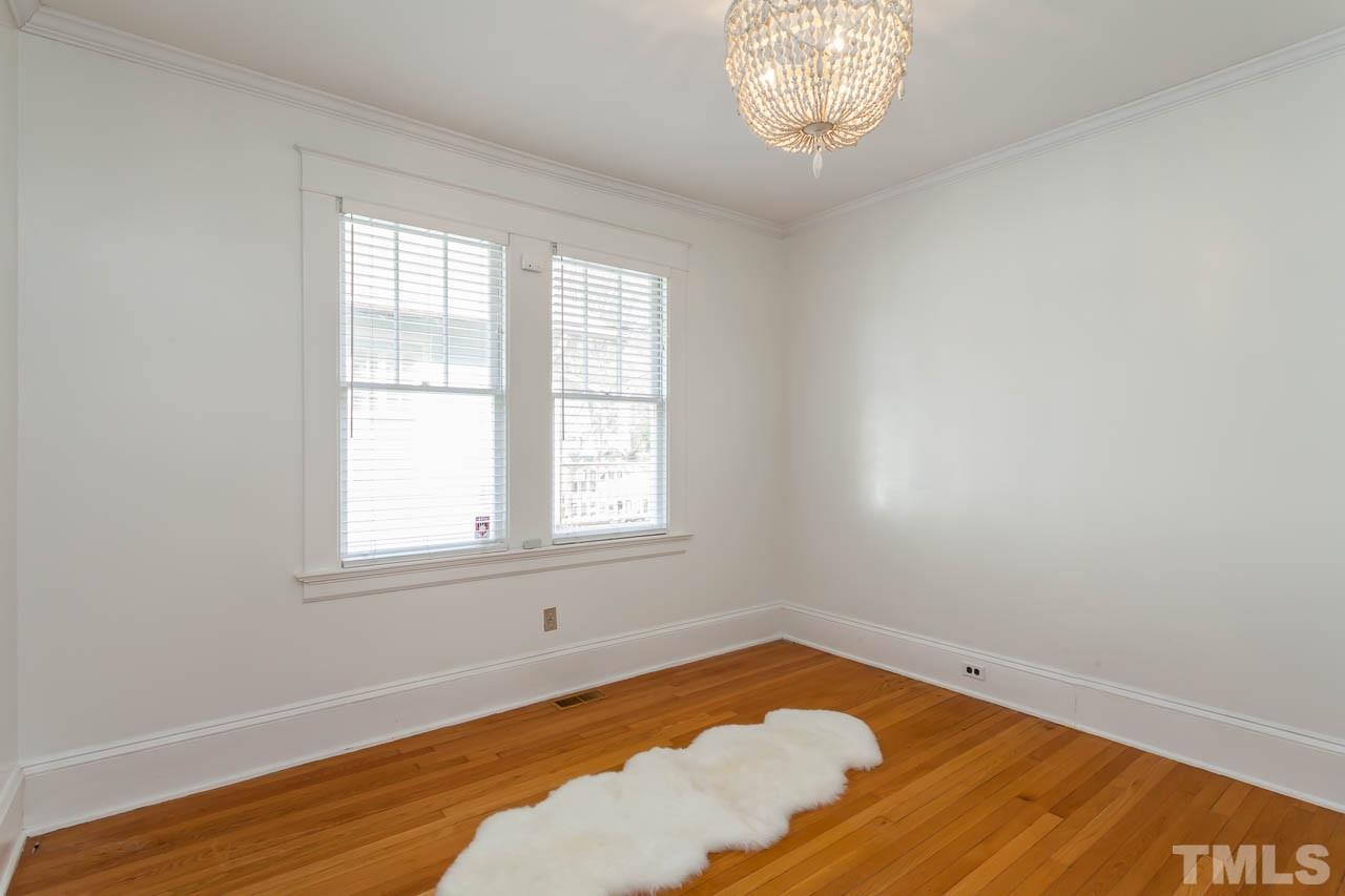 1702 Dare Street Raleigh, NC 27608 - Photo 17 of 25 an empty room with a window