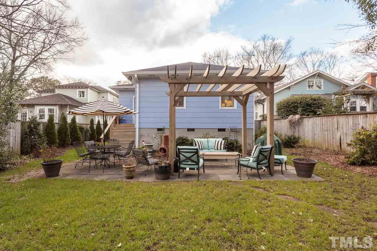 1702 Dare Street Raleigh, NC 27608 - Photo 23 of 25 a backyard of a house with table and chairs