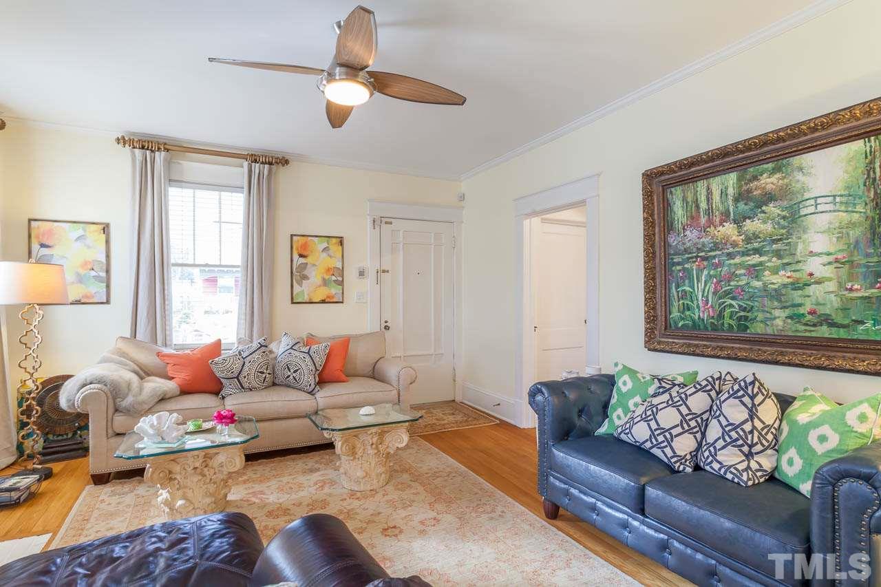 1702 Dare Street Raleigh, NC 27608 - Photo 8 of 25 a living room with furniture and a large window