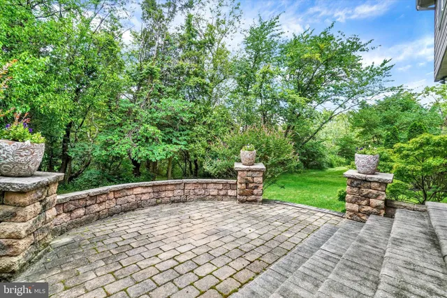 a view of a backyard with sitting area