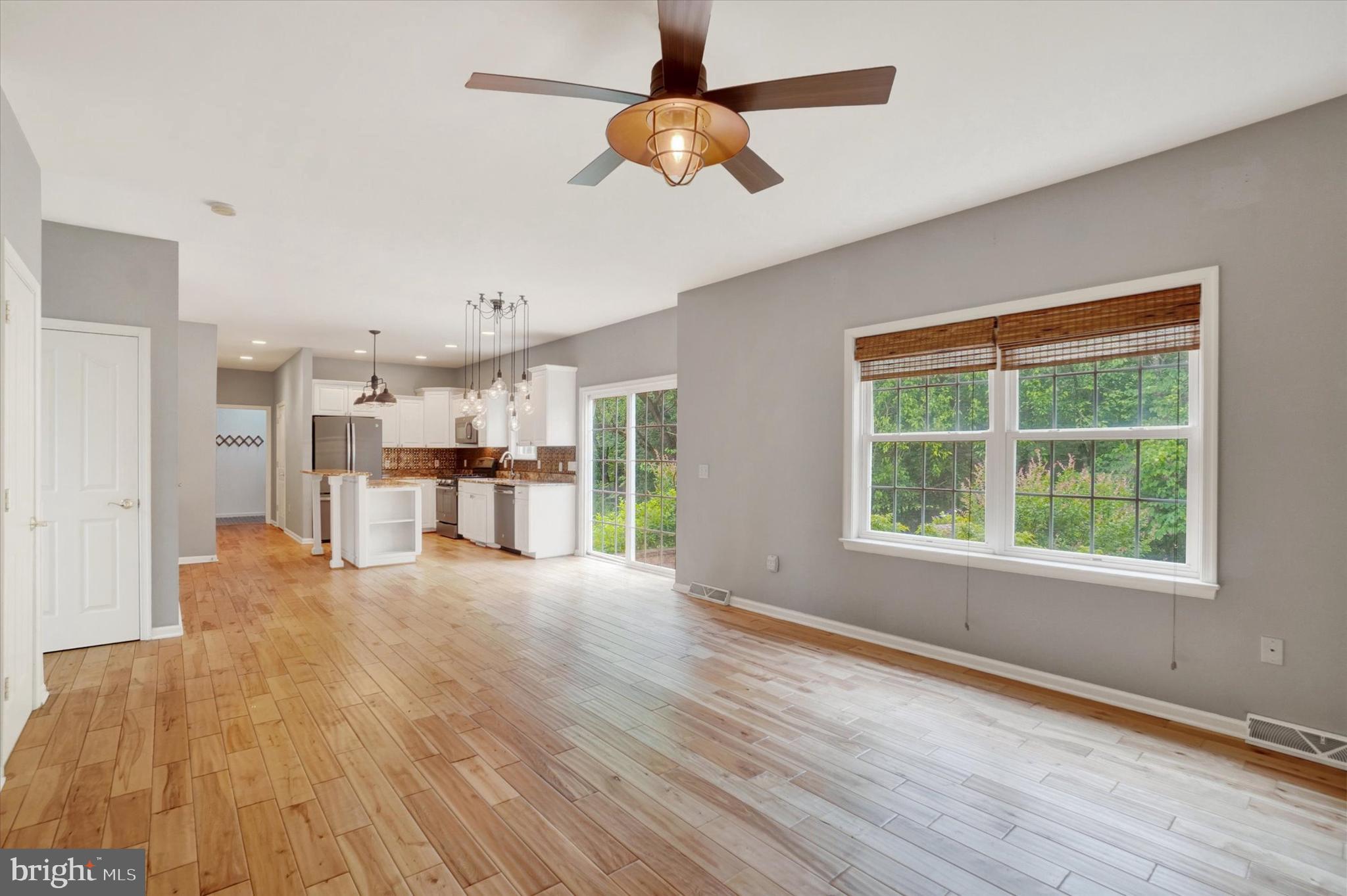 857 Willow Ridge Court York, PA 17404 - Photo 13 of 27 a view of an empty room with wooden floor and a window