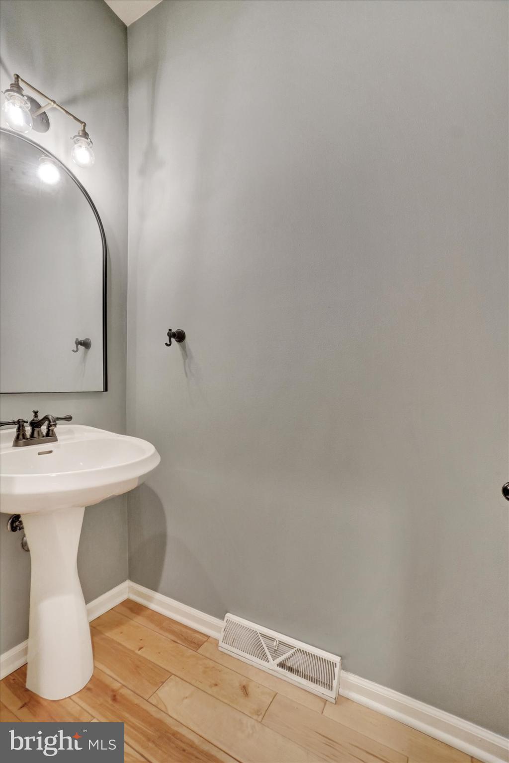 857 Willow Ridge Court York, PA 17404 - Photo 16 of 27 a bathroom with a sink a toilet and mirror