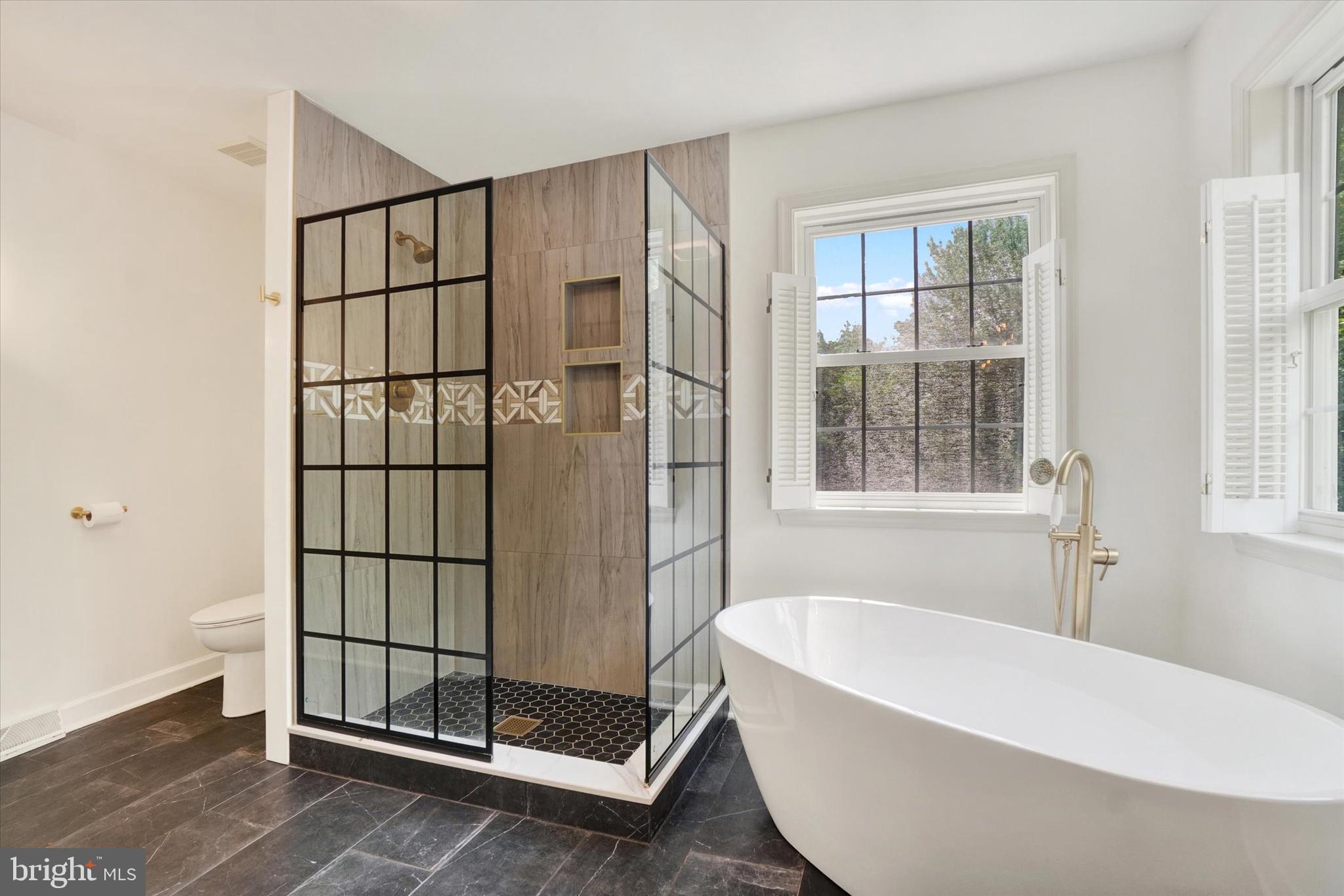 857 Willow Ridge Court York, PA 17404 - Photo 20 of 27 a bathroom with a bathtub and next to a window