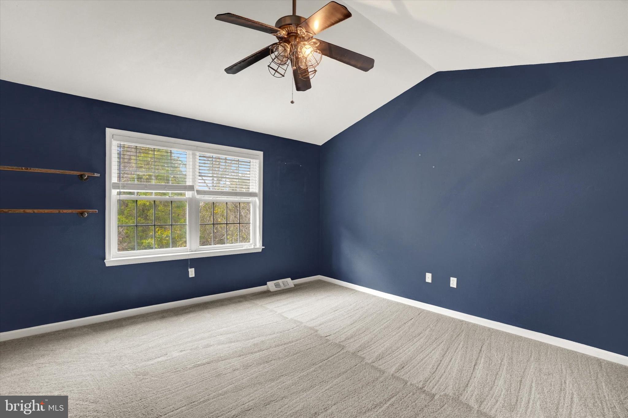 857 Willow Ridge Court York, PA 17404 - Photo 21 of 27 an empty room with a window and a ceiling fan