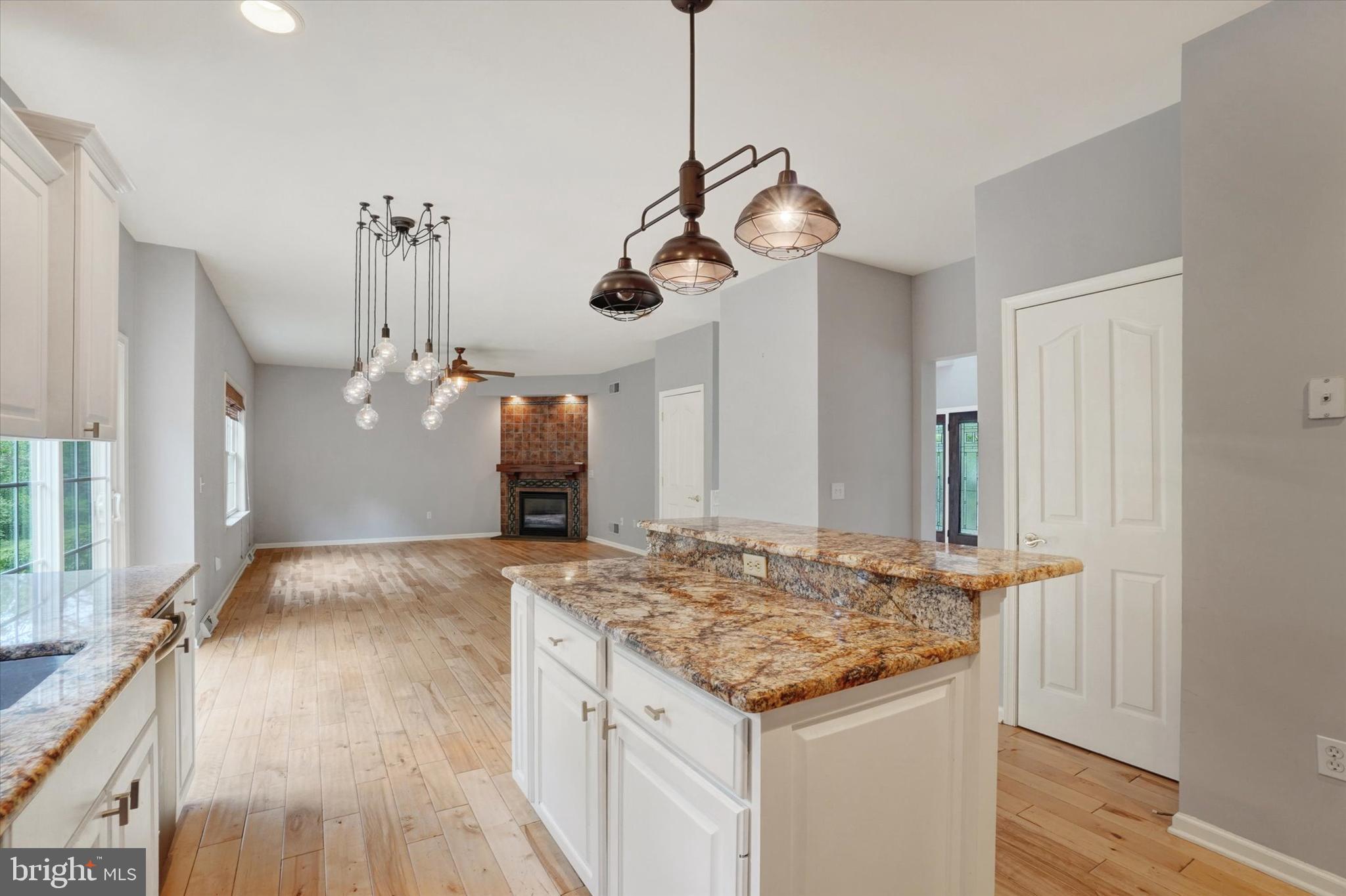 857 Willow Ridge Court York, PA 17404 - Photo 9 of 27 a kitchen with a table and chandelier