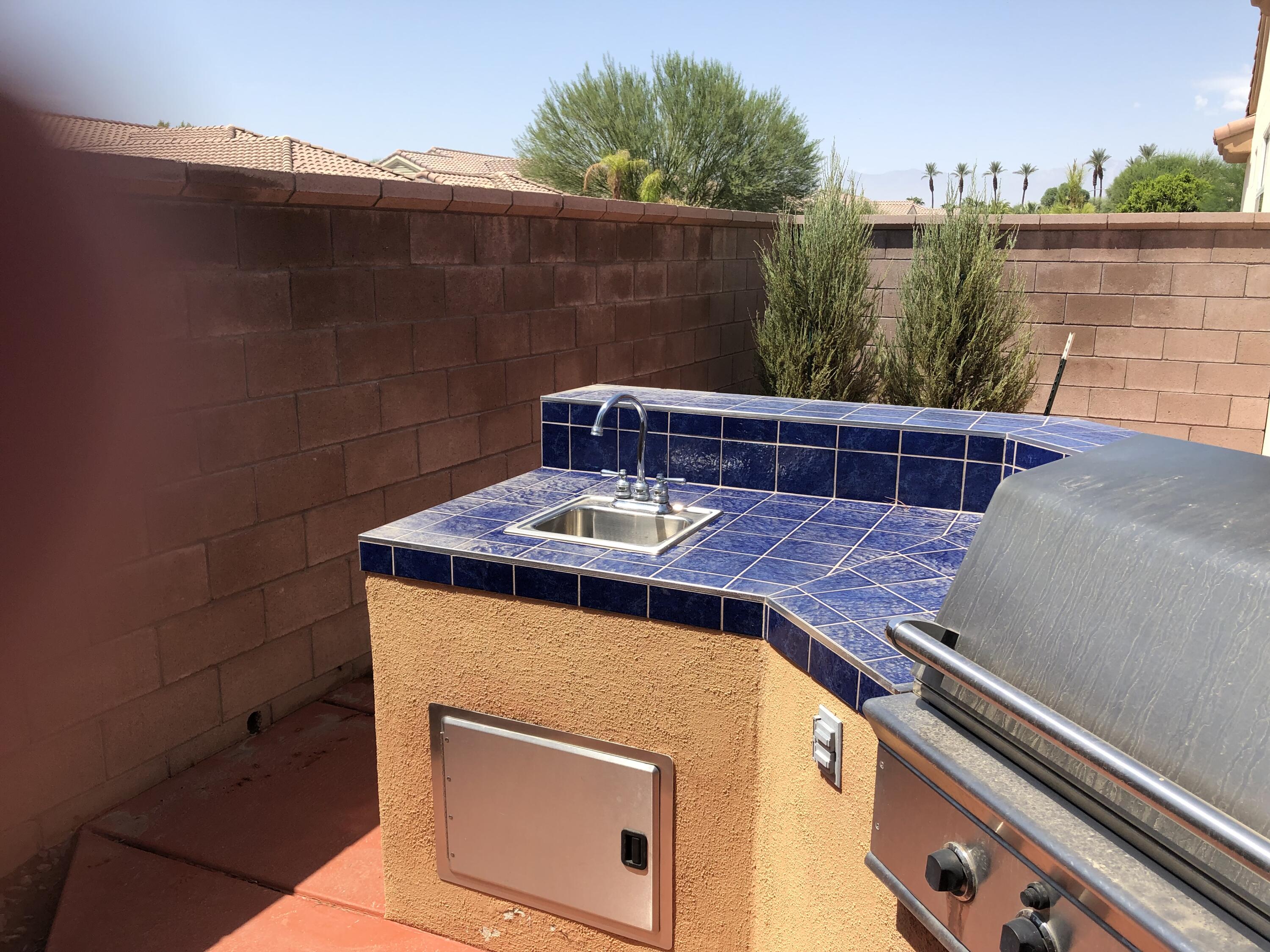 35932 Beringer Road Palm Desert, CA 92211 - Photo 13 of 44 a view of a patio with a table and chairs