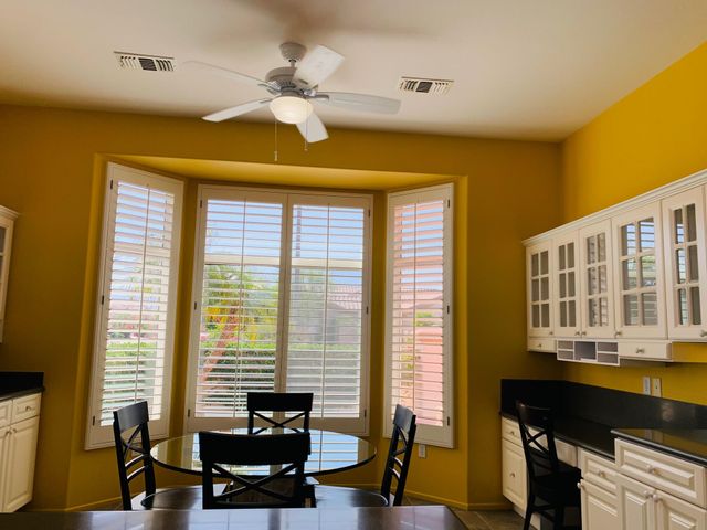 a view of a livingroom with furniture and a window