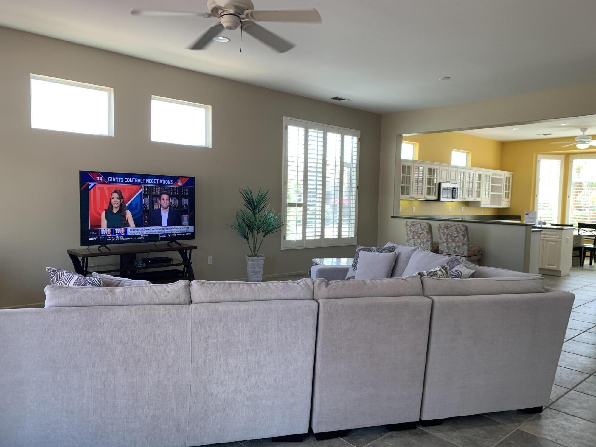 35932 Beringer Road Palm Desert, CA 92211 - Photo 22 of 44 a living room with furniture and a flat screen tv