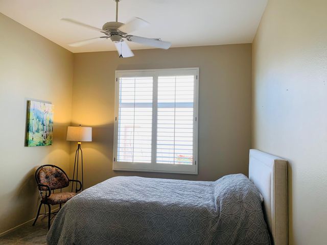 an empty room with windows closet and livingroom view
