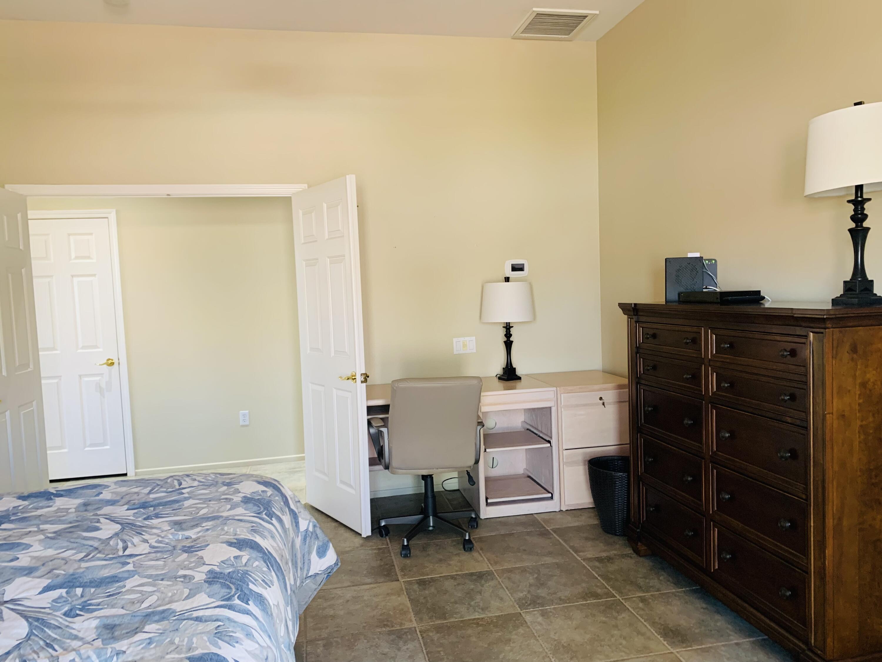 35932 Beringer Road Palm Desert, CA 92211 - Photo 33 of 44 a bed room with a bed and a chair